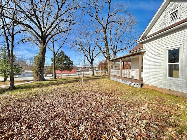 view of yard with covered porch