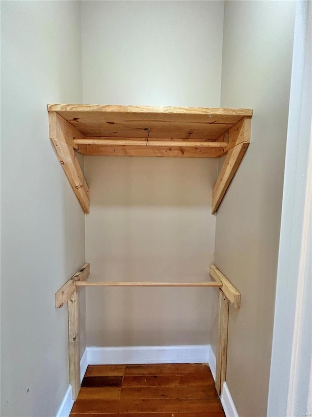 walk in closet featuring dark wood-type flooring