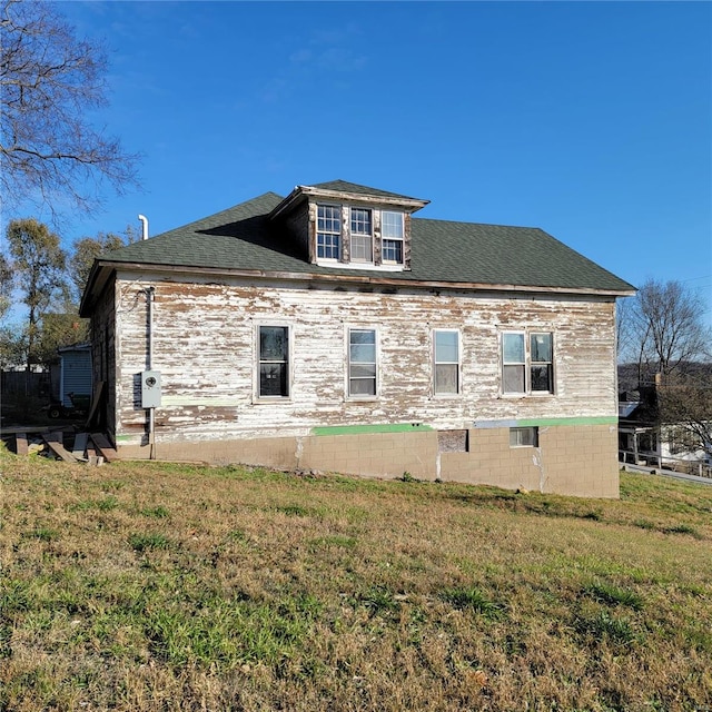 view of home's exterior featuring a yard