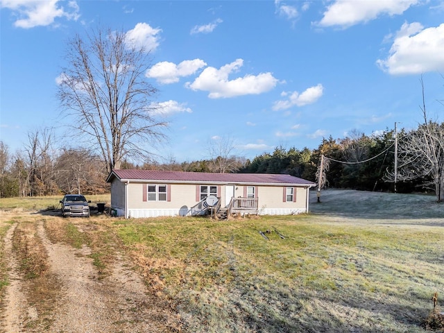 manufactured / mobile home with a front lawn