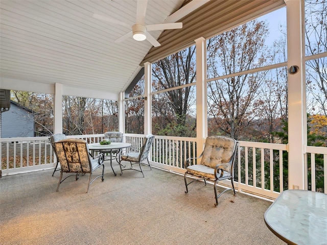 exterior space featuring ceiling fan, lofted ceiling, and wood ceiling