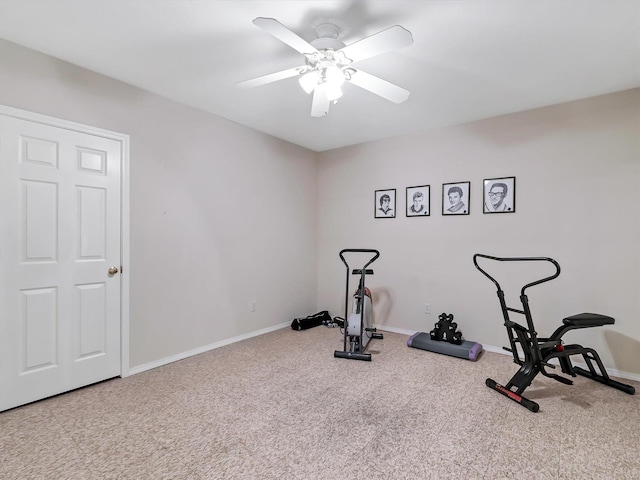 exercise area featuring carpet and ceiling fan