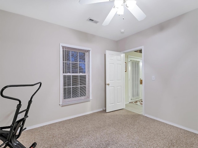 unfurnished office with ceiling fan