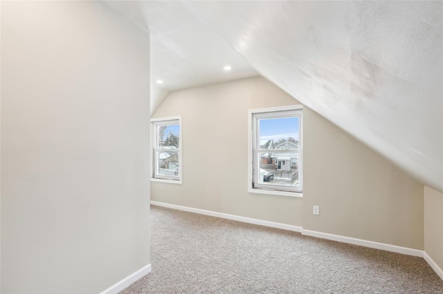 bonus room featuring carpet and lofted ceiling