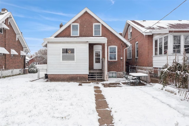 view of snow covered house