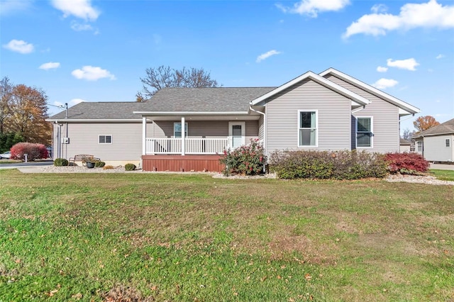 single story home with covered porch and a front lawn