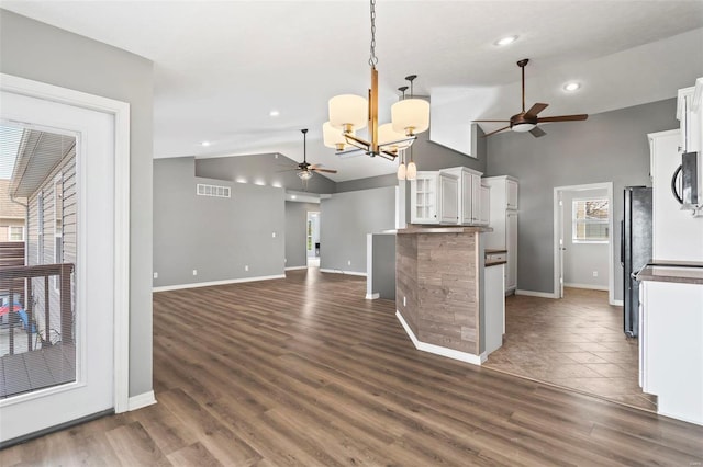 kitchen featuring white cabinets, pendant lighting, and dark hardwood / wood-style flooring