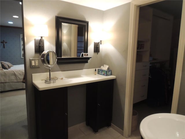 bathroom featuring vanity and a tub to relax in