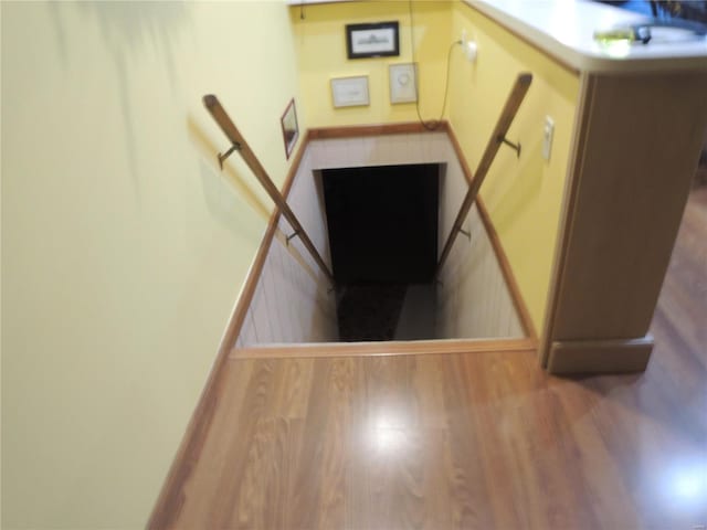 staircase featuring hardwood / wood-style floors