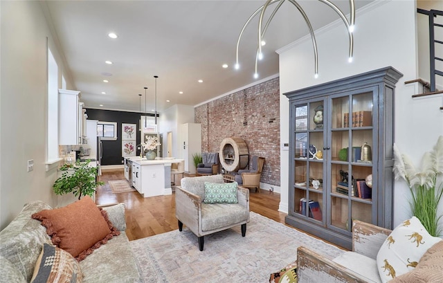 living room with light hardwood / wood-style floors and crown molding