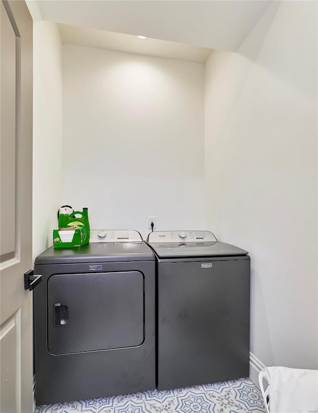 washroom with washer and dryer