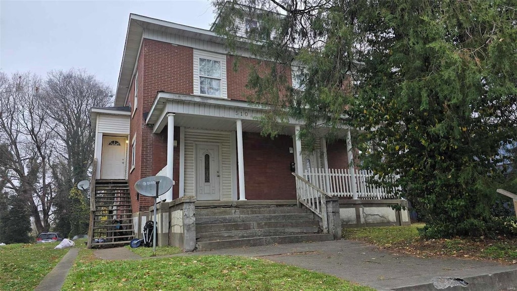 view of front of property featuring covered porch