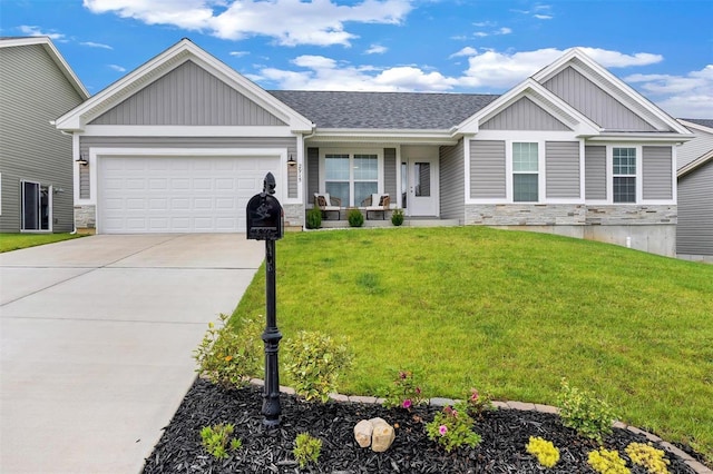 craftsman-style home featuring a front lawn and a garage