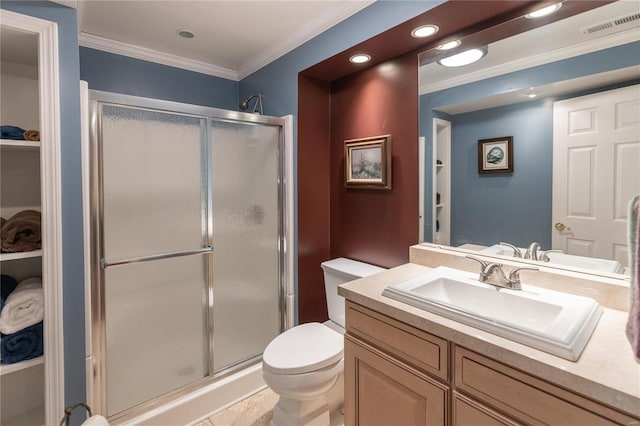 bathroom with tile patterned flooring, vanity, a shower with shower door, and ornamental molding