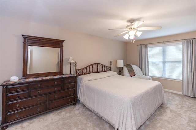 bedroom featuring light carpet and ceiling fan