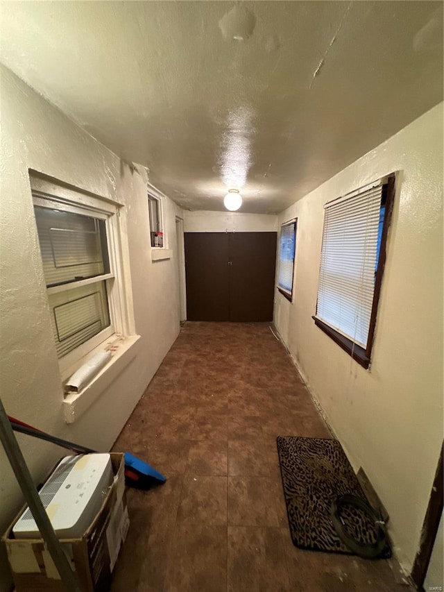 hallway featuring a textured ceiling