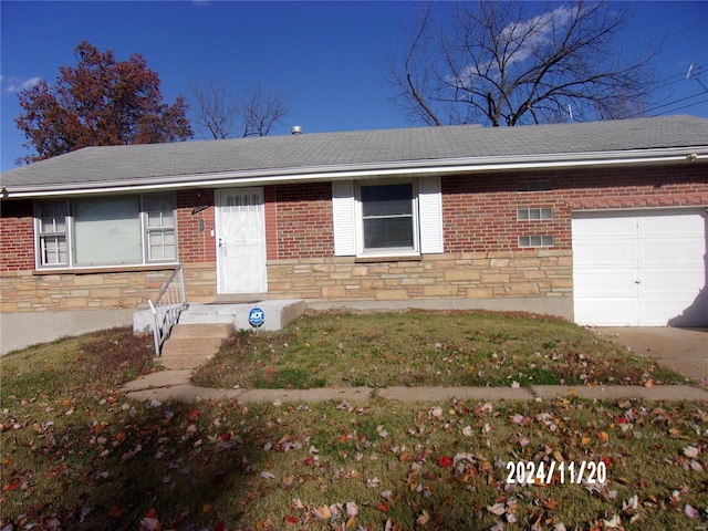 ranch-style home featuring an attached garage, brick siding, stone siding, and a shingled roof