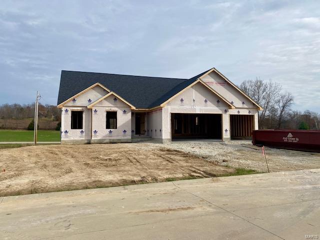 property in mid-construction featuring a garage