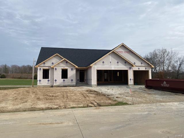 unfinished property with a garage