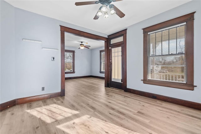 spare room with light hardwood / wood-style floors and ceiling fan