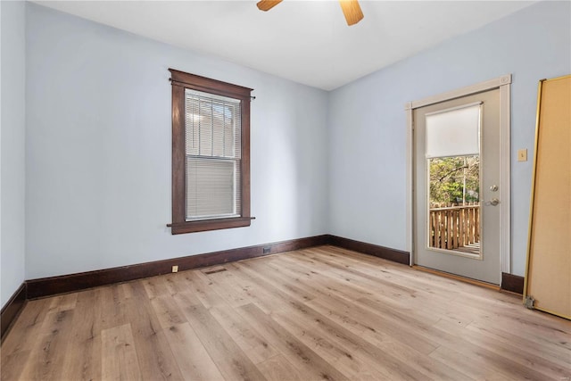 unfurnished room with ceiling fan and light wood-type flooring