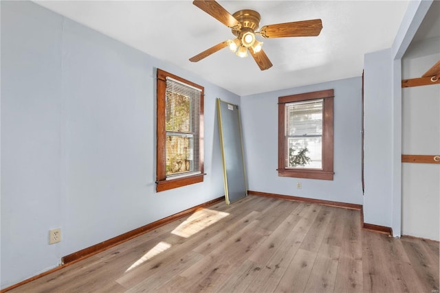 unfurnished room featuring light hardwood / wood-style floors and ceiling fan