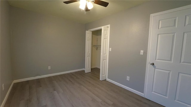 unfurnished bedroom featuring ceiling fan and light wood-type flooring