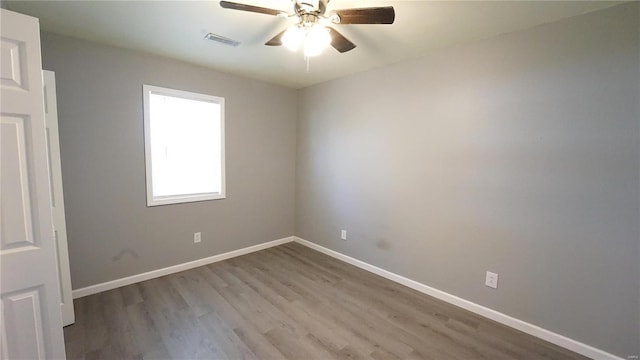 unfurnished room featuring light hardwood / wood-style floors and ceiling fan