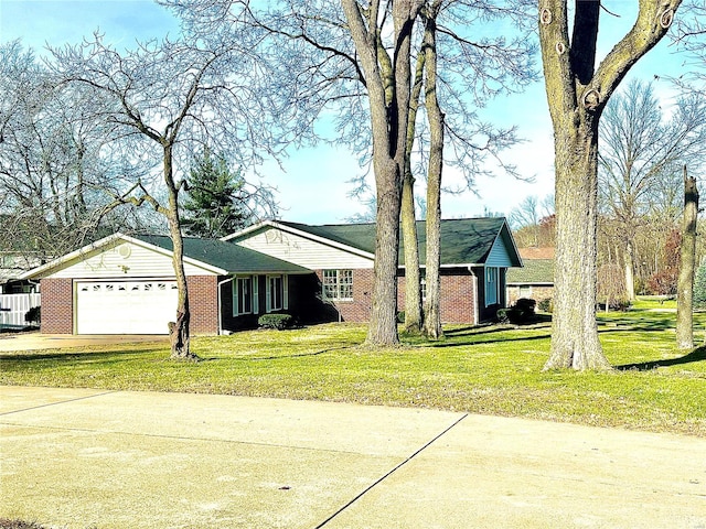 single story home with a front yard and a garage