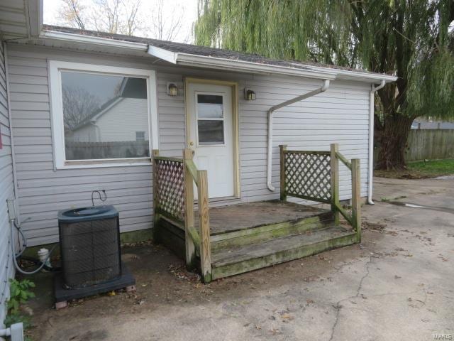 property entrance with central AC unit