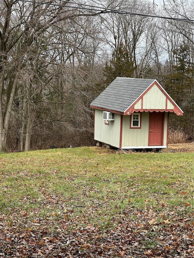 view of outdoor structure featuring a lawn