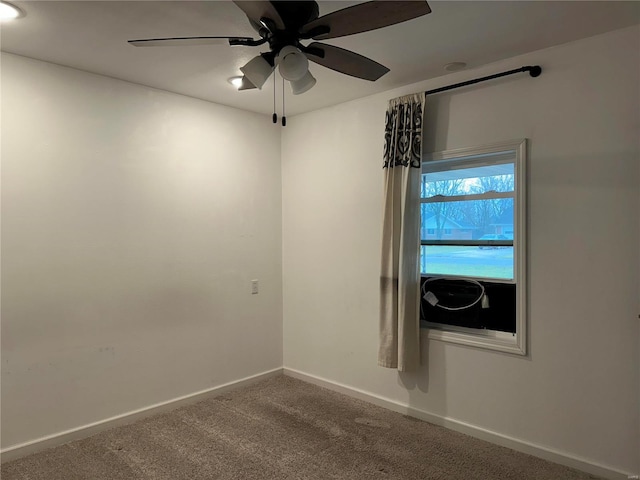 spare room featuring carpet floors and ceiling fan