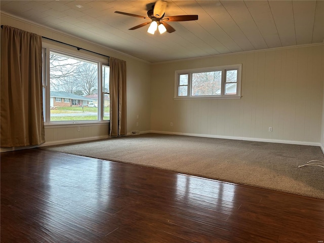 empty room featuring hardwood / wood-style floors, ceiling fan, and crown molding