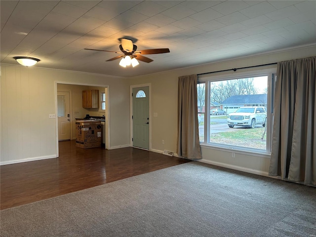 interior space featuring ceiling fan, crown molding, and a healthy amount of sunlight