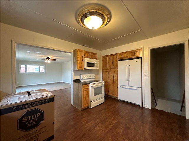 kitchen with ceiling fan, dark hardwood / wood-style floors, and white appliances