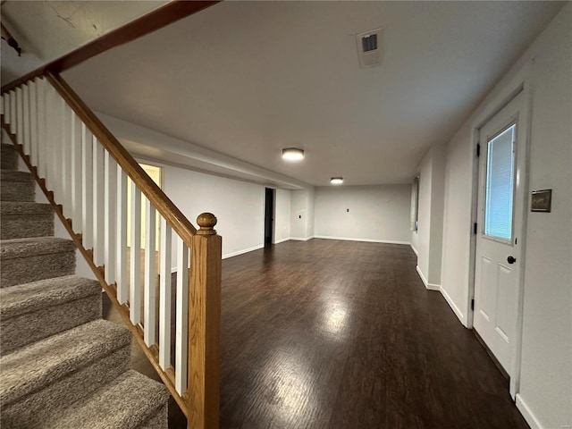 basement with dark wood-type flooring