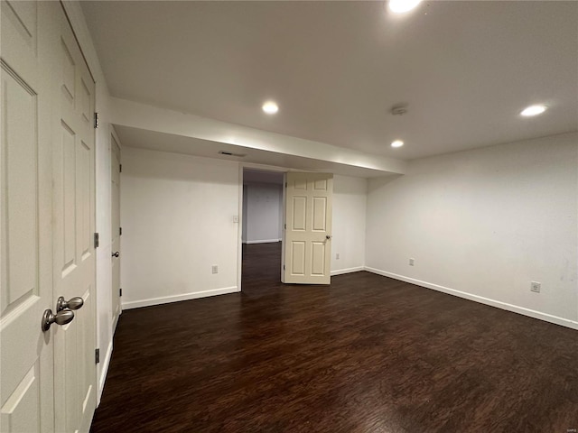 basement featuring dark wood-type flooring