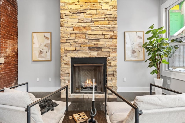 living room featuring a fireplace and dark hardwood / wood-style flooring