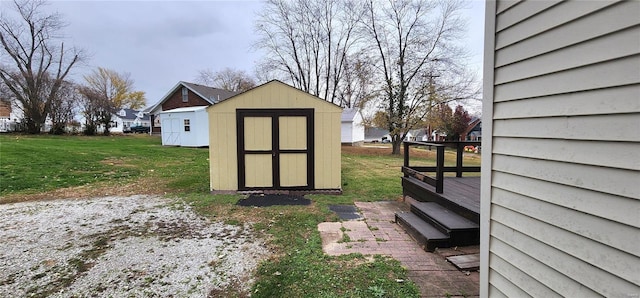 view of outbuilding with a lawn