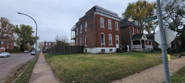 view of property exterior with a yard