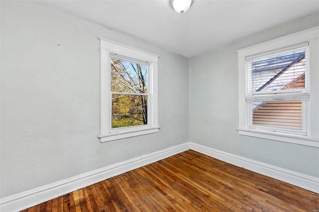 unfurnished room featuring hardwood / wood-style flooring