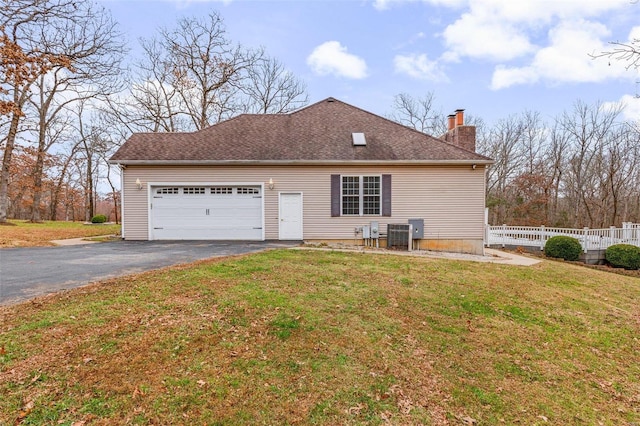 exterior space with a garage and a front yard