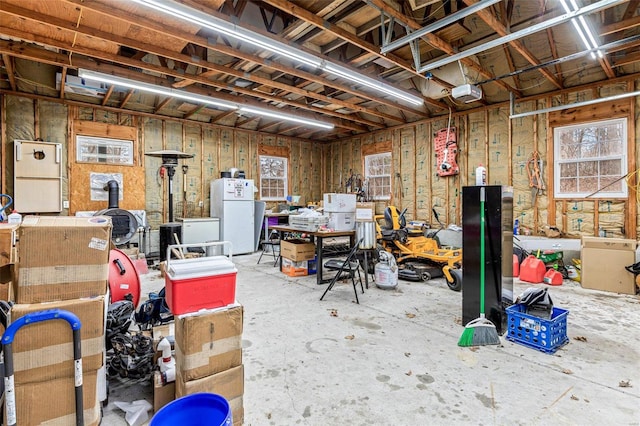 basement featuring white fridge