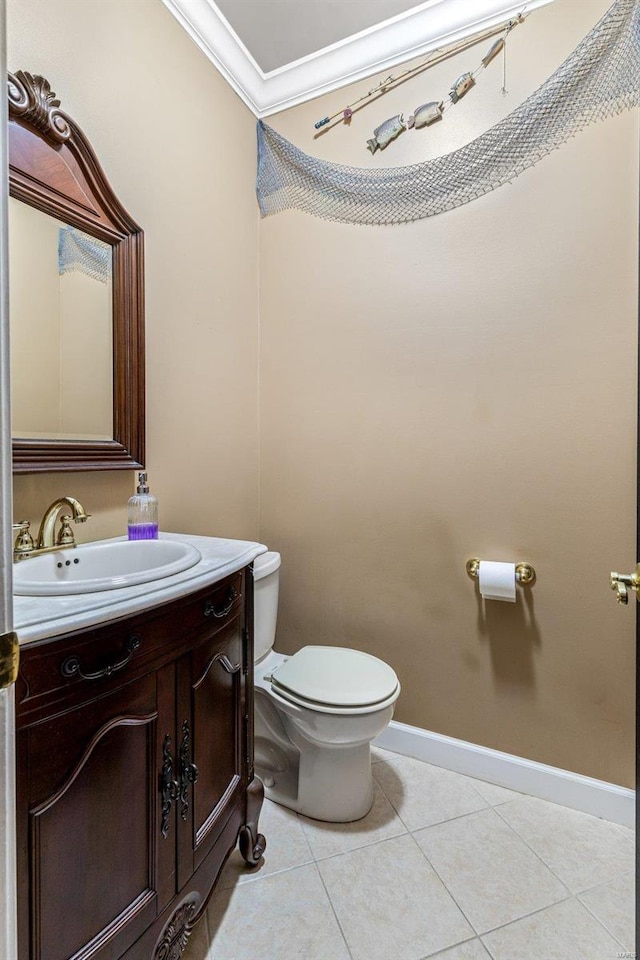 bathroom featuring tile patterned floors, vanity, toilet, and ornamental molding