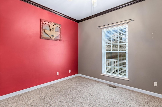 unfurnished room with carpet and crown molding