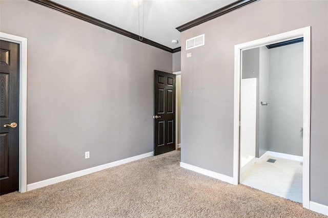 unfurnished bedroom with ornamental molding and light carpet