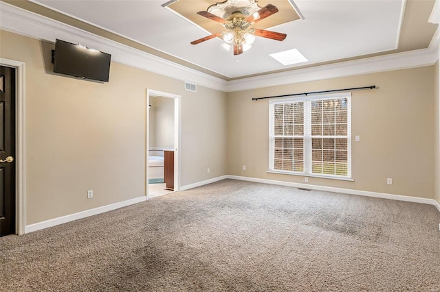 empty room with carpet, ceiling fan, and crown molding