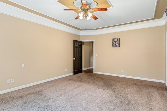 carpeted empty room featuring ceiling fan and ornamental molding