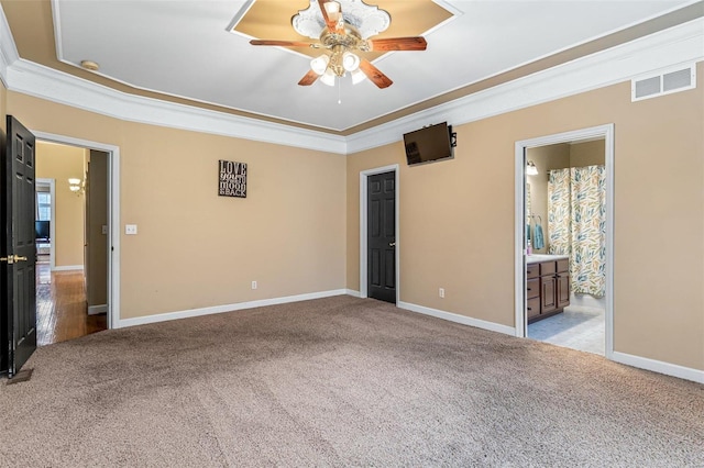 carpeted empty room featuring ceiling fan and ornamental molding