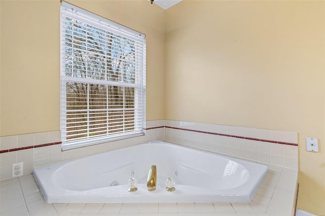 bathroom featuring tiled tub